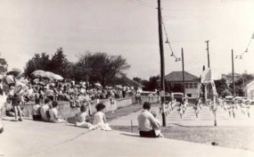 Archival photograph of a school or community sports day with spectators.